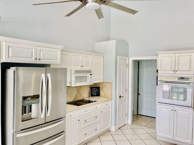 1358 Windsor Park Rd, Gulf Breeze, FL 32563 - kitchen with white appliances, a ceiling fan, decorative backsplash, light tile patterned floors, and light countertops