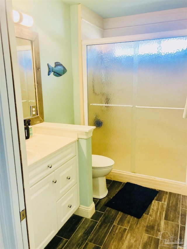 1358 Windsor Park Rd, Gulf Breeze, FL 32563 - full bathroom featuring wood tiled floors, vanity, and a stall shower
