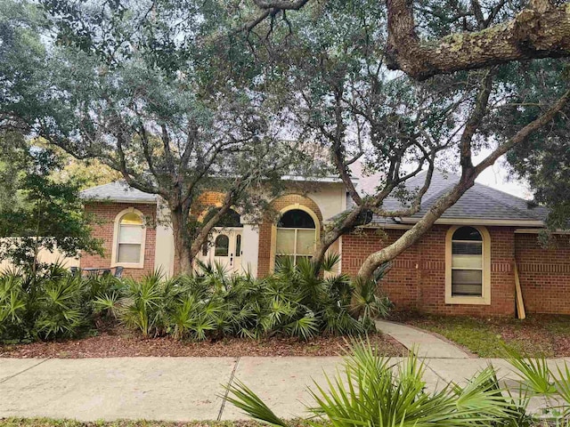 1358 Windsor Park Rd, Gulf Breeze, FL 32563 - view of property hidden behind natural elements with brick siding