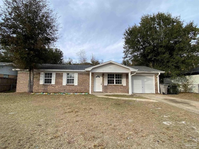 single story home featuring a garage and a front lawn