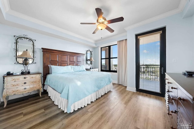 bedroom with crown molding, hardwood / wood-style floors, access to exterior, and ceiling fan