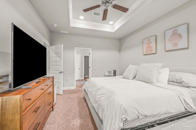 bedroom with crown molding, a raised ceiling, recessed lighting, light colored carpet, and a ceiling fan