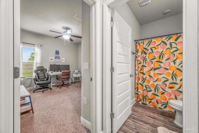 office with ceiling fan, baseboards, and carpet flooring