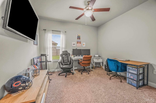 carpeted office featuring ceiling fan and baseboards