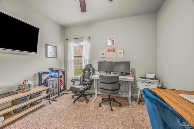 office space with carpet floors, ceiling fan, and baseboards
