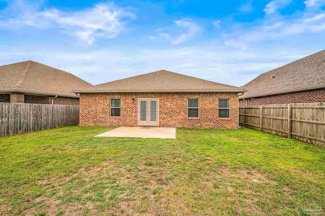 back of property featuring french doors, a patio area, and brick siding