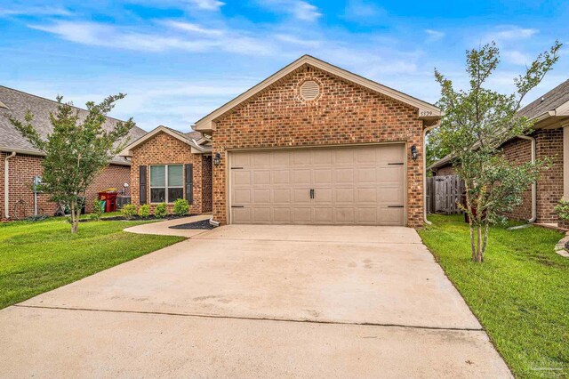 view of front of home featuring brick siding, driveway, and an attached garage