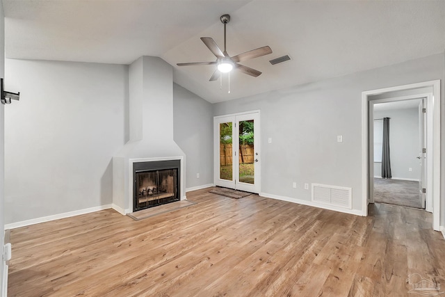 6205 E Forest Pines Dr, Pensacola, FL 32526 - unfurnished living room featuring a ceiling fan, lofted ceiling, light wood-style floors, and a fireplace