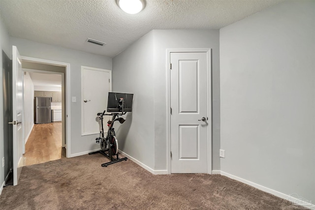 6205 E Forest Pines Dr, Pensacola, FL 32526 - workout area with carpet flooring and a textured ceiling
