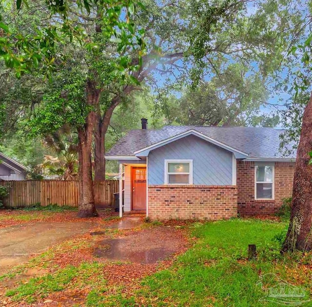 6205 E Forest Pines Dr, Pensacola, FL 32526 - view of front of home featuring brick siding and a shingled roof