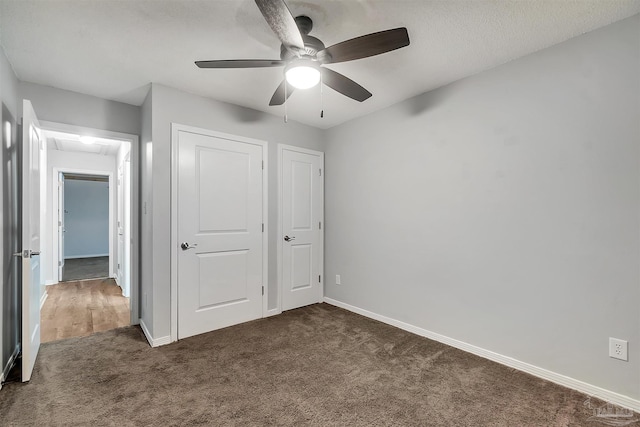 6205 E Forest Pines Dr, Pensacola, FL 32526 - unfurnished bedroom featuring dark carpet, attic access, a ceiling fan, and a closet