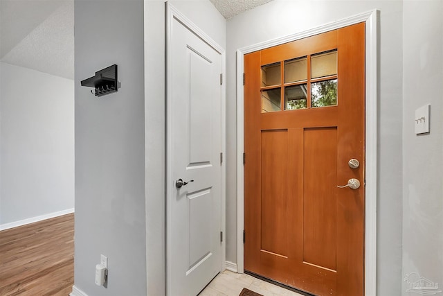 6205 E Forest Pines Dr, Pensacola, FL 32526 - entryway with a textured ceiling and baseboards