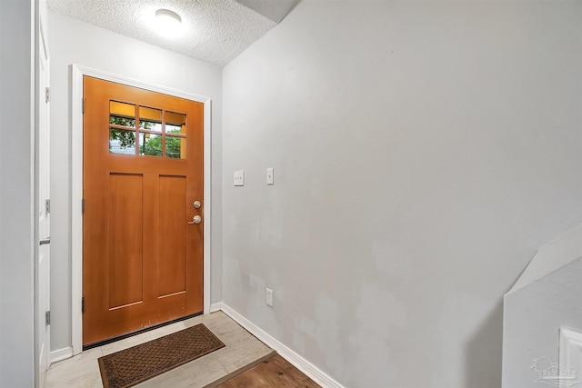 6205 E Forest Pines Dr, Pensacola, FL 32526 - entrance foyer featuring a textured ceiling and light wood finished floors