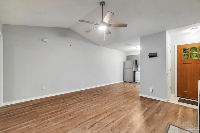6205 E Forest Pines Dr, Pensacola, FL 32526 - unfurnished living room with a ceiling fan, light wood finished floors, and vaulted ceiling