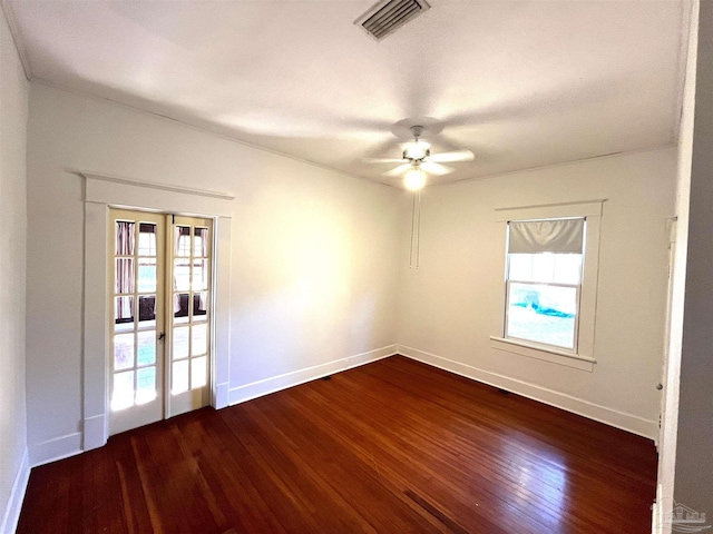 1011 N Reus St, Pensacola, FL 32501 - spare room with visible vents, baseboards, dark wood finished floors, french doors, and a ceiling fan