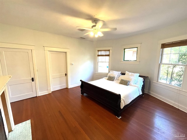 1011 N Reus St, Pensacola, FL 32501 - bedroom with ceiling fan, visible vents, baseboards, and dark wood-style floors
