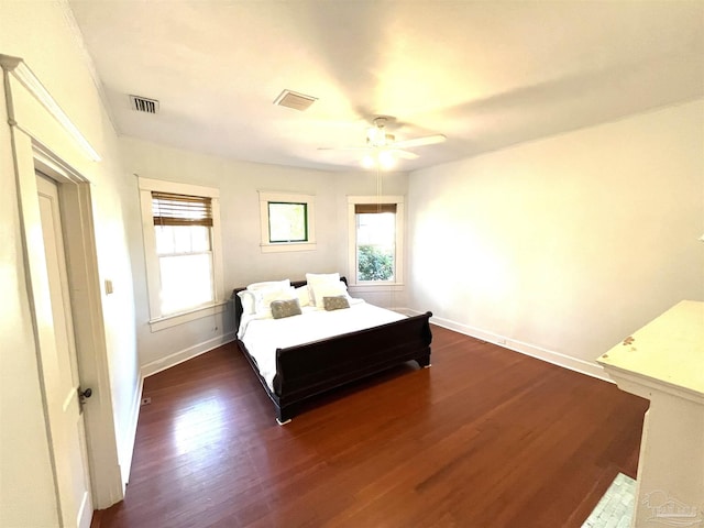 1011 N Reus St, Pensacola, FL 32501 - bedroom featuring dark wood finished floors, visible vents, multiple windows, and baseboards