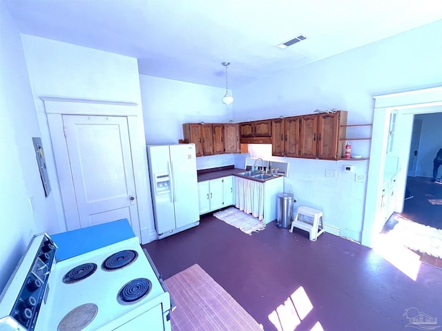 1011 N Reus St, Pensacola, FL 32501 - kitchen featuring white appliances, visible vents, finished concrete floors, a sink, and decorative light fixtures