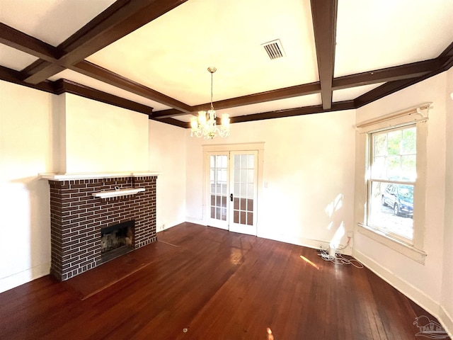 1011 N Reus St, Pensacola, FL 32501 - unfurnished living room with baseboards, coffered ceiling, a brick fireplace, and hardwood / wood-style flooring