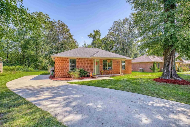 ranch-style home with a front lawn