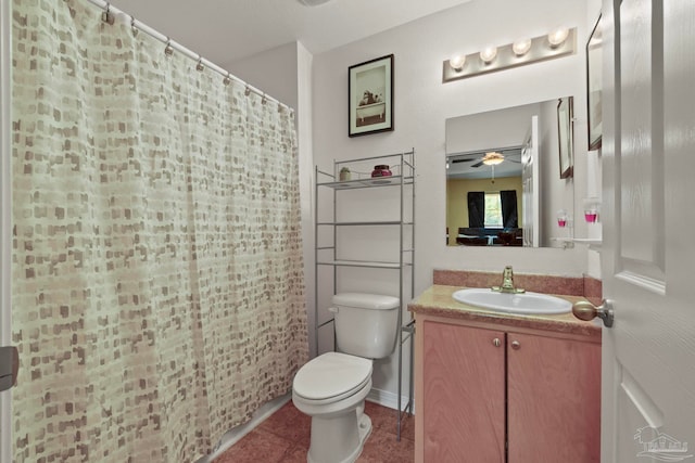 bathroom featuring toilet, ceiling fan, a shower with curtain, vanity, and tile patterned flooring