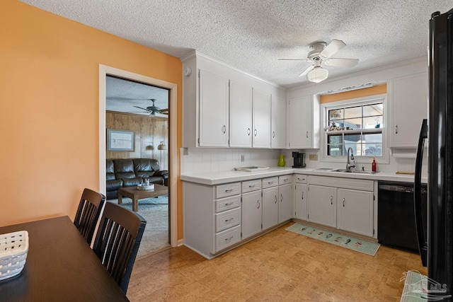 kitchen with sink, a textured ceiling, ceiling fan, and black appliances