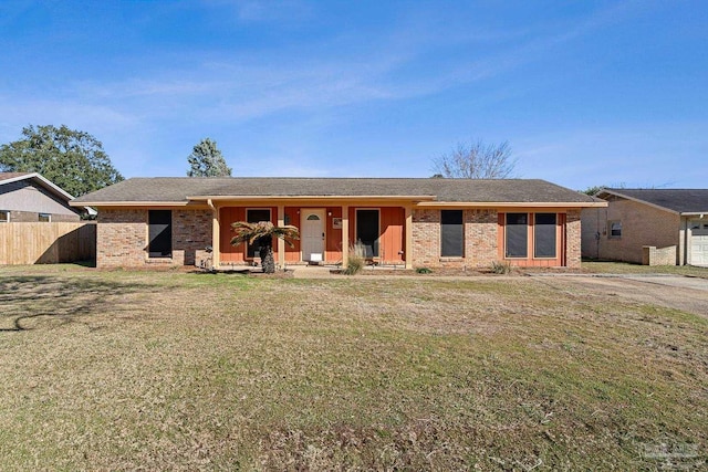 ranch-style house with a front lawn