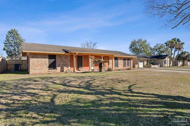 single story home with a front yard and central air condition unit