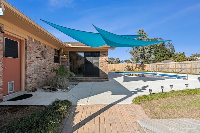 view of patio / terrace featuring a fenced in pool