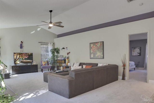 living room featuring carpet, ceiling fan, and lofted ceiling