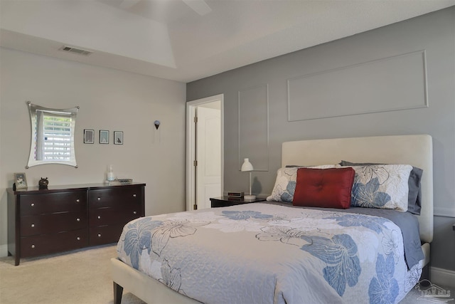 bedroom with ceiling fan and light colored carpet