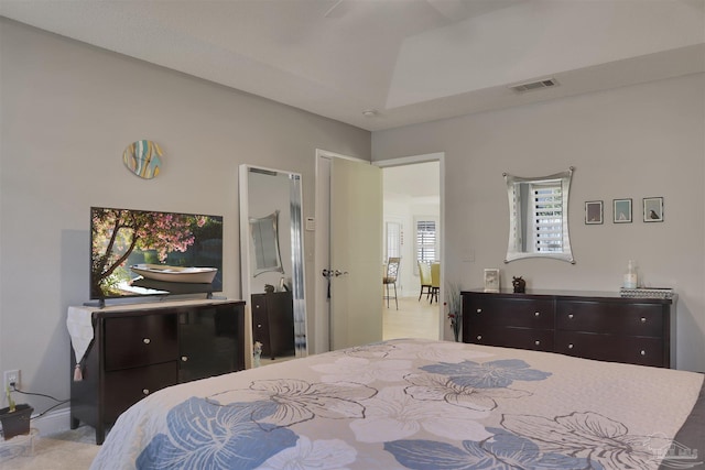 bedroom with a raised ceiling