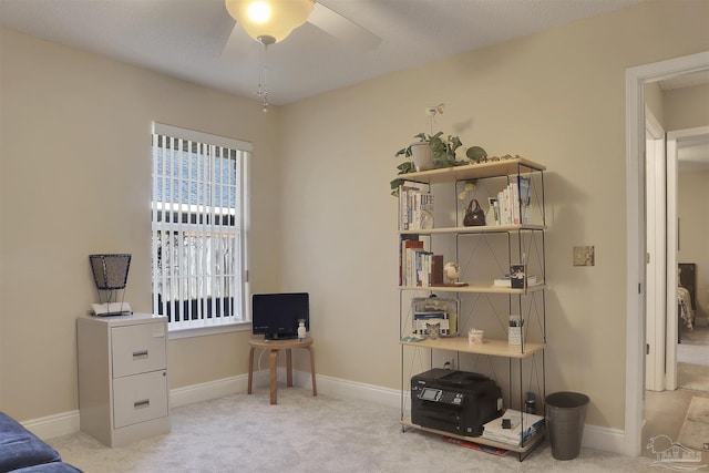 sitting room featuring light carpet and ceiling fan