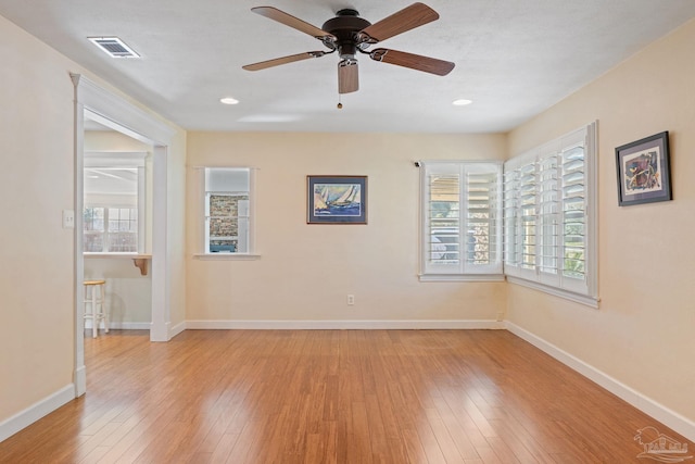 empty room with light wood-type flooring and ceiling fan