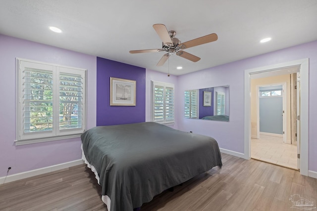 bedroom featuring light wood-type flooring and ceiling fan