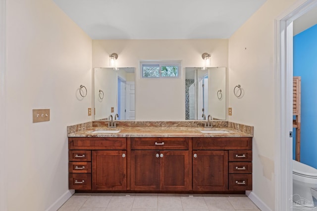 bathroom featuring vanity, toilet, and tile patterned floors