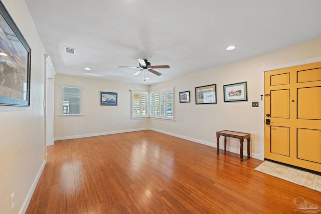 foyer with light wood-type flooring and ceiling fan