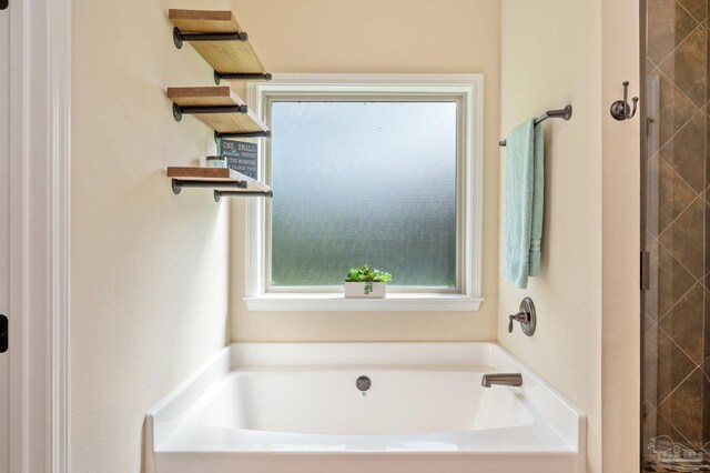 full bathroom with a bath