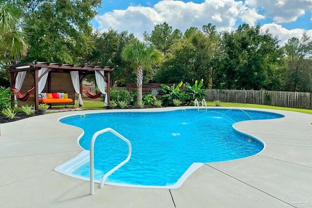 view of swimming pool with a pergola, a fenced in pool, a fenced backyard, and a patio area