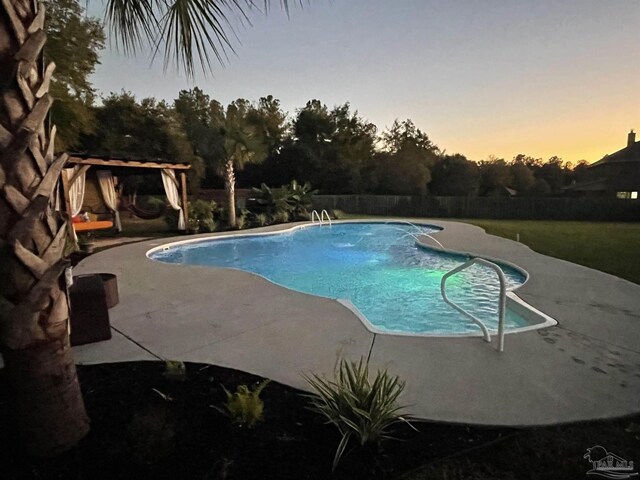 view of swimming pool featuring a patio, a fenced in pool, and fence