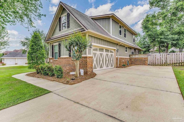 exterior space featuring a garage and a yard