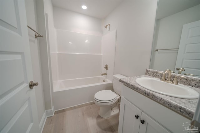 full bathroom featuring shower / washtub combination, wood-type flooring, vanity, and toilet