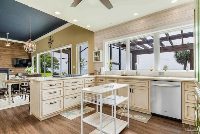 kitchen with stainless steel appliances, light countertops, dark wood-type flooring, and wood walls