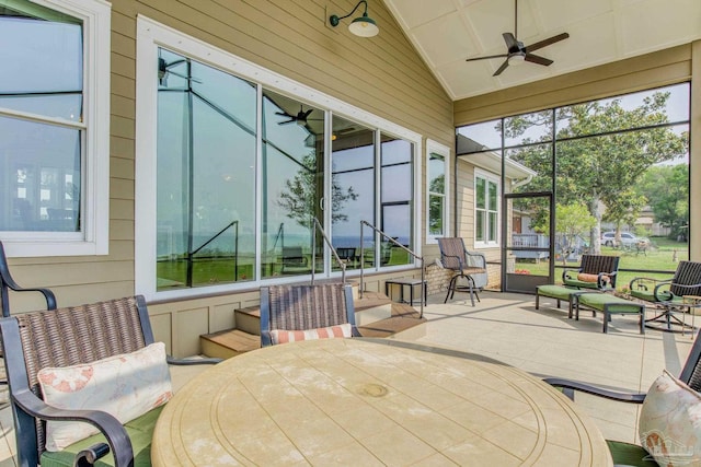 sunroom / solarium featuring vaulted ceiling and ceiling fan