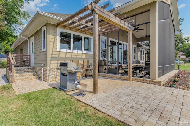 exterior space with a ceiling fan and grilling area