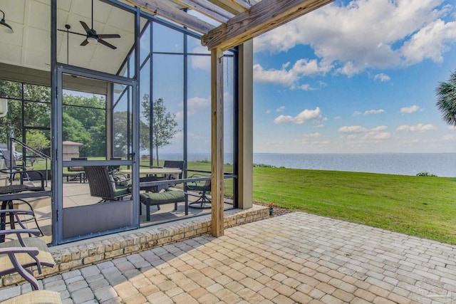 view of patio / terrace featuring ceiling fan and a water view