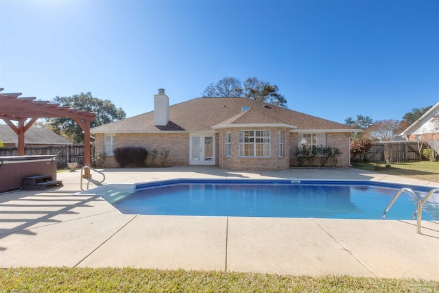 view of pool featuring a pergola, a patio area, french doors, and a hot tub