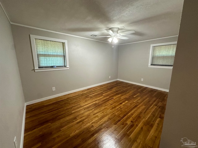 unfurnished room featuring ceiling fan, a textured ceiling, crown molding, and dark hardwood / wood-style flooring