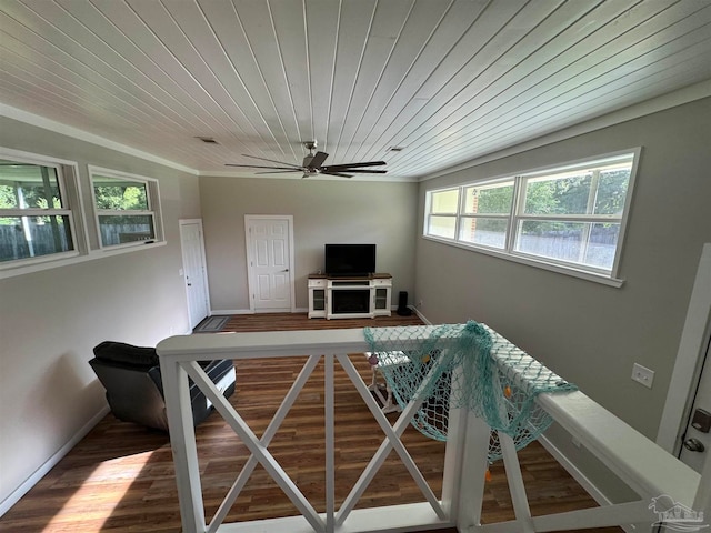 unfurnished dining area featuring ceiling fan, wooden ceiling, and hardwood / wood-style floors