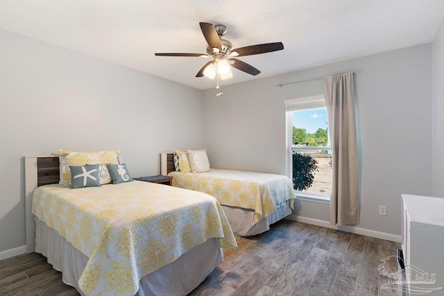 bedroom featuring ceiling fan and dark hardwood / wood-style flooring